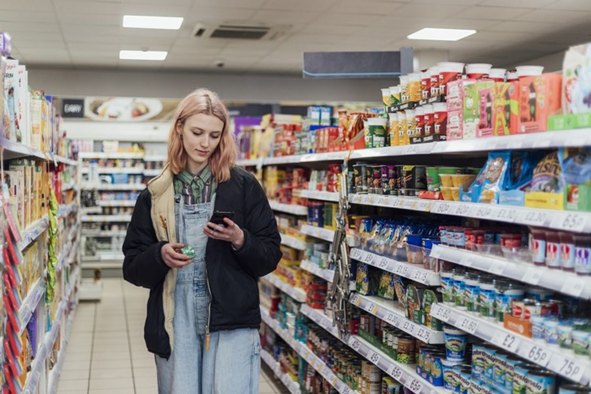 UK high street shoppers browsing food, homeware, and toys during summer retail sales surge