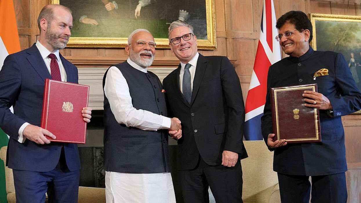 UK Prime Minister Keir Starmer and Indian PM Narendra Modi sign historic trade deal cutting tariffs on whisky, cars, and textiles