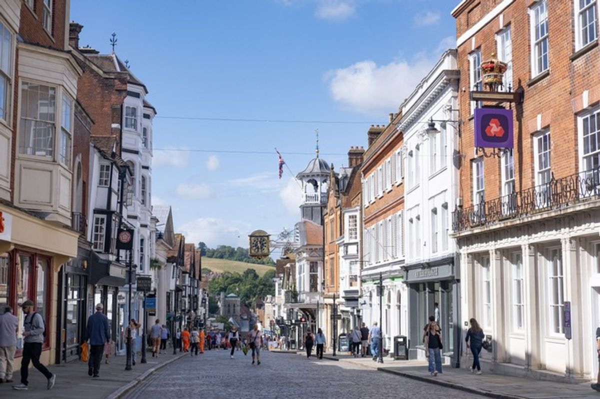 UK shoppers in high street during summer retail surge