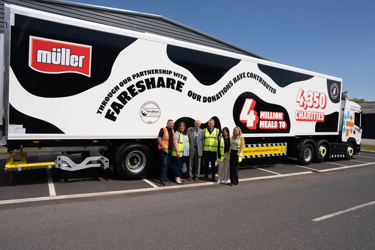 Volunteers at FareShare depot celebrating 4 million meals donated by Müller UK