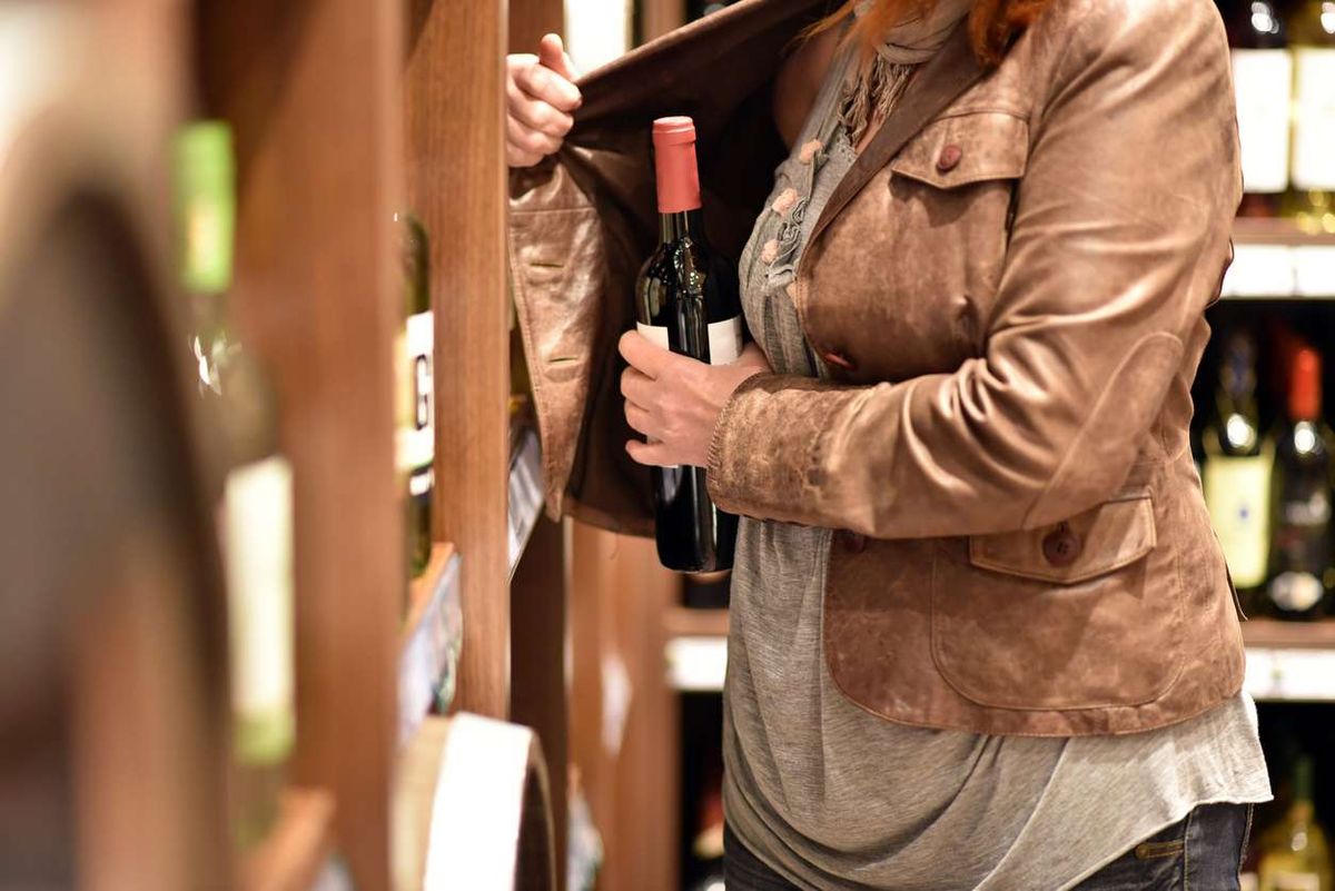 woman shoplifting 