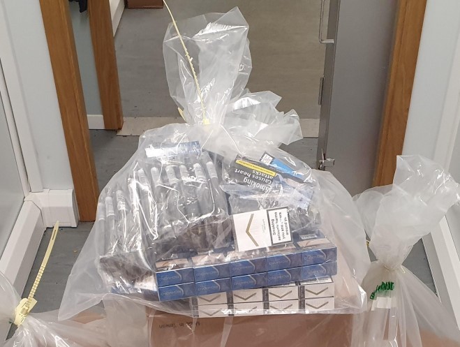 Laughing gas canisters and illicit tobacco found at Bolton store