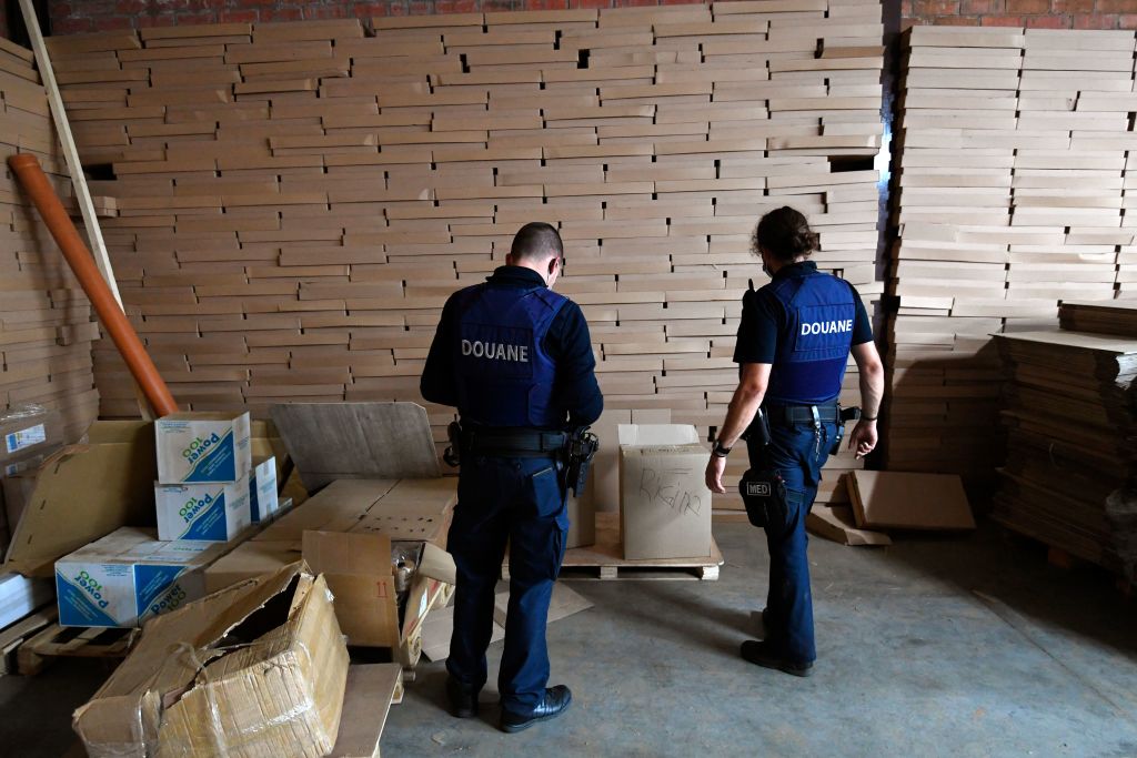 Counterfeit cigarettes with UK health warnings found ready for shipment in Belgium raids
